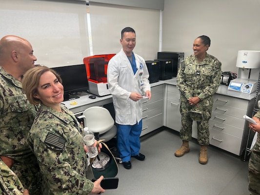 Master Chief Richard Moreno (left), Lt. Cmdr. Pamela Cole Foss (center-right), and Capt. Janiese Cleckley (right) meet with staff assigned to the 412th Medical Group during a tour of medical facilities at Edwards Air Force Base on May 14, 2026. Leaders from Naval Hospital Twentynine Palms visited Edwards Air Force Base to strengthen cross-service collaboration, improve interoperability, and identify new opportunities to enhance medical readiness and healthcare delivery across the Mojave Desert region. (Courtesy photo)