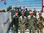 Col. Mary Carnduff (front left), Capt. Janiese Cleckley (front-center-left), Master Chief Richard Moreno (front-center-right), and staff assigned to the 412th Medical Group and Naval Hospital Twentynine Palms gather for a group photo during a visit to Edwards Air Force Base on May 14, 2026. The visit focused on strengthening cross-service collaboration, improving interoperability, and identifying new opportunities to enhance medical readiness and healthcare delivery across the Mojave Desert region. (Courtesy photo)
