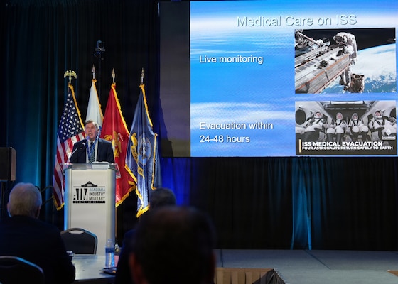 SAN ANTONIO – (May 19, 2026) – NASA Astronaut, retired Marine Corps Col. Dr. David Hilmers, a professor at Baylor College of Medicine, served as the lunch keynote speaker at the annual AIM Health R&D Summit held at the Henry B. Gonzalez Convention Center. Designed to promote cross-sector collaboration in the development of life-saving battlefield technologies, the one-day summit brings together top innovators from academia, industry, and the military to accelerate the research, development, and commercialization of transformative medical technologies. Collaborating and working alongside a wide range of research and development partners keeps Navy Medicine Research & Development (NMR&D) abreast of best practices and advances in medical knowledge. NAMRU San Antonio, part of NMR&D conducts gap-driven combat casualty care, craniofacial, and directed energy research in support of Navy, Marine Corps and joint U.S. warfighter health readiness and lethality while engaged in routine and expeditionary operations. (U.S. Navy photo by Burrell Parmer, NAMRU San Antonio Public Affairs/Released)