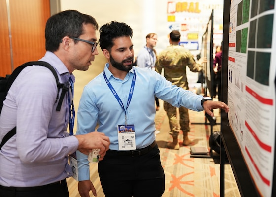 SAN ANTONIO – (May 19, 2026) – Juan Curbelo, a research associate assigned to Naval Medical Research Unit (NAMRU) San Antonio’s Cellular and Immune Based Adjuncts Department, won first place in the science poster session at the annual AIM Health R&D Summit held at the Henry B. Gonzalez Convention Center. Curbelo presented research on “95 Ghz Radiofrequency Energy elicits Unique Functional and Molecular Changes in Immune and Vascular Endothelial Cells.” Designed to promote cross-sector collaboration in the development of life-saving battlefield technologies, the one-day summit brings together top innovators from academia, industry, and the military to accelerate the research, development, and commercialization of transformative medical technologies. Collaborating and working alongside a wide range of research and development partners keeps Navy Medicine Research & Development (NMR&D) abreast of best practices and advances in medical knowledge. NAMRU San Antonio, part of NMR&D conducts gap-driven combat casualty care, craniofacial, and directed energy research in support of Navy, Marine Corps and joint U.S. warfighter health readiness and lethality while engaged in routine and expeditionary operations. (U.S. Navy photo by Burrell Parmer, NAMRU San Antonio Public Affairs/Released)