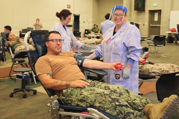 Chief Hospital Corpsman Jacob Tester of Navy Medicine Readiness and Training Command Twentynine Palms donates blood during a record-breaking Armed Services Blood Program blood drive at Marine Corps Air Ground Combat Center Twentynine Palms, May 6, 2026. The blood drive collected 117 units of blood in support of military operations overseas, setting a new installation record for collections during a single event. (U.S. Navy photo by Christopher Jones, NH/NMRTC Twentynine Palms public affairs officer)