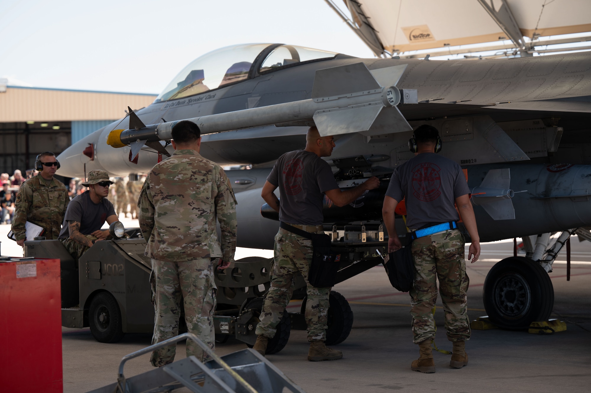 U.S. Air National Guard service members assigned to the Air National Guard Air Force Reserve Command Test Center (AATC) load munitions to an F-16 Fighter Falcon during the annual Weapons Load Competition at Morris Air National Guard Base, Ariz., May 1, 2026. AATC is responsible for operational and developmental test and evaluation and tactics development and evaluation for all ARC weapons systems. AATC is a unique, efficient, and effective organization driving 80 percent solutions at 20 percent of the cost and remains focused on continuing the legacy of unmatched response to warfighter requirements and transformational support to Air Force missions. (U.S. Air National Guard photo by Staff Sgt. Guadalupe Beltran)