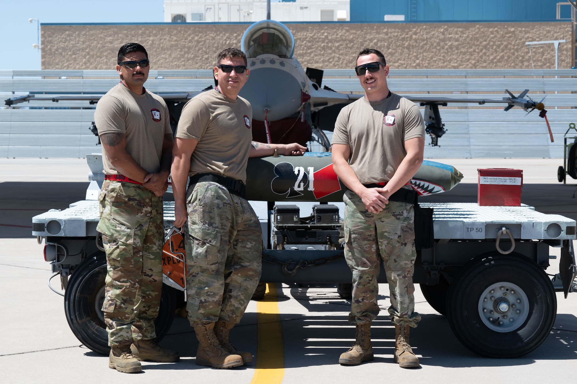 U.S. Air National Guard service members assigned to the 21st Fighter Squadron Aircraft Maintenance Unit gather during the annual Weapons Load Competition at Morris Air National Guard Base, Ariz., May 1, 2026. The event highlights the critical role weapons troops play in sustaining combat air power and ensuring aircraft remain mission capable. (U.S. Air National Guard photo by Staff Sgt. Guadalupe Beltran)
