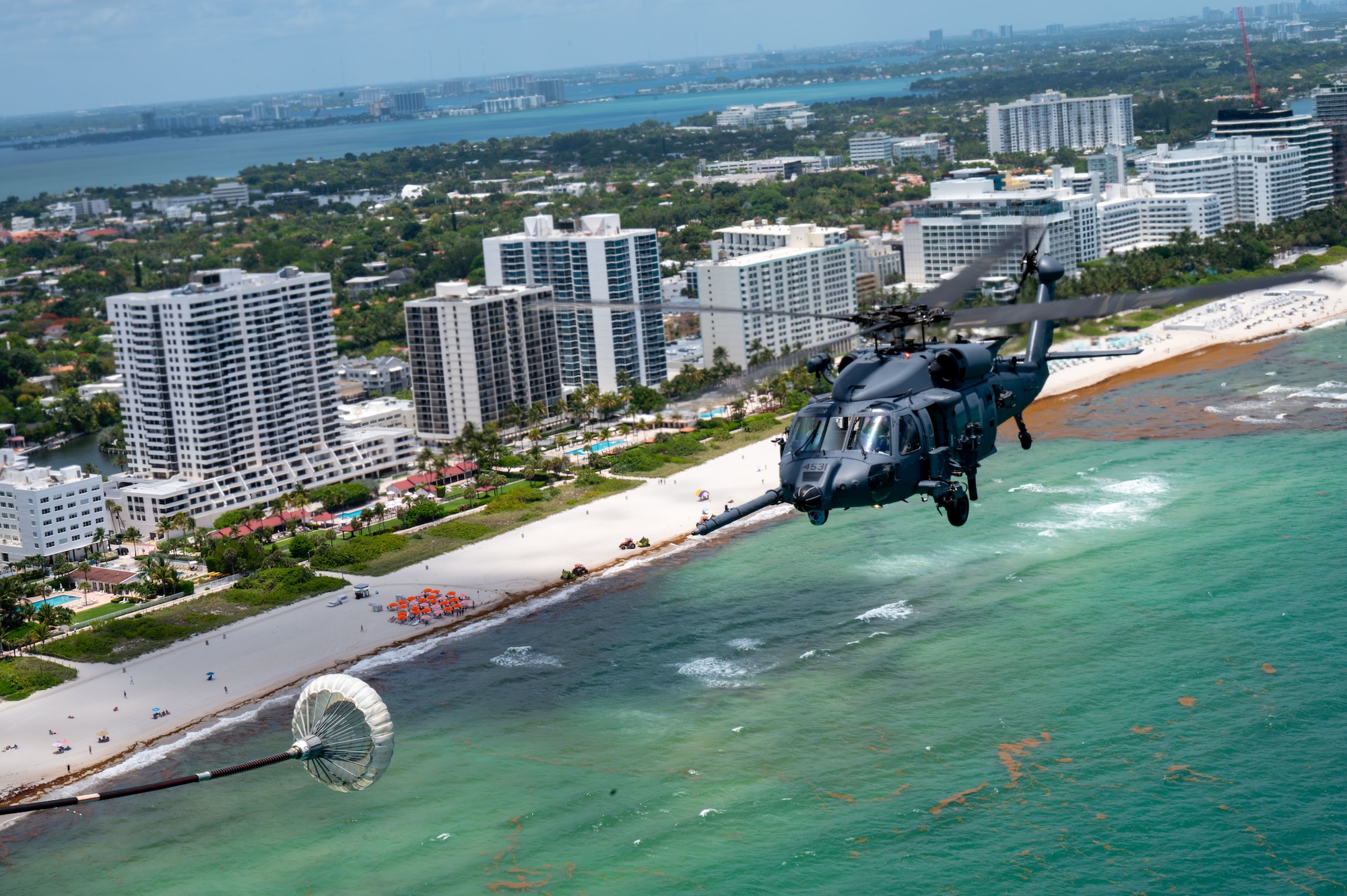 Helcopter flies next to beach
