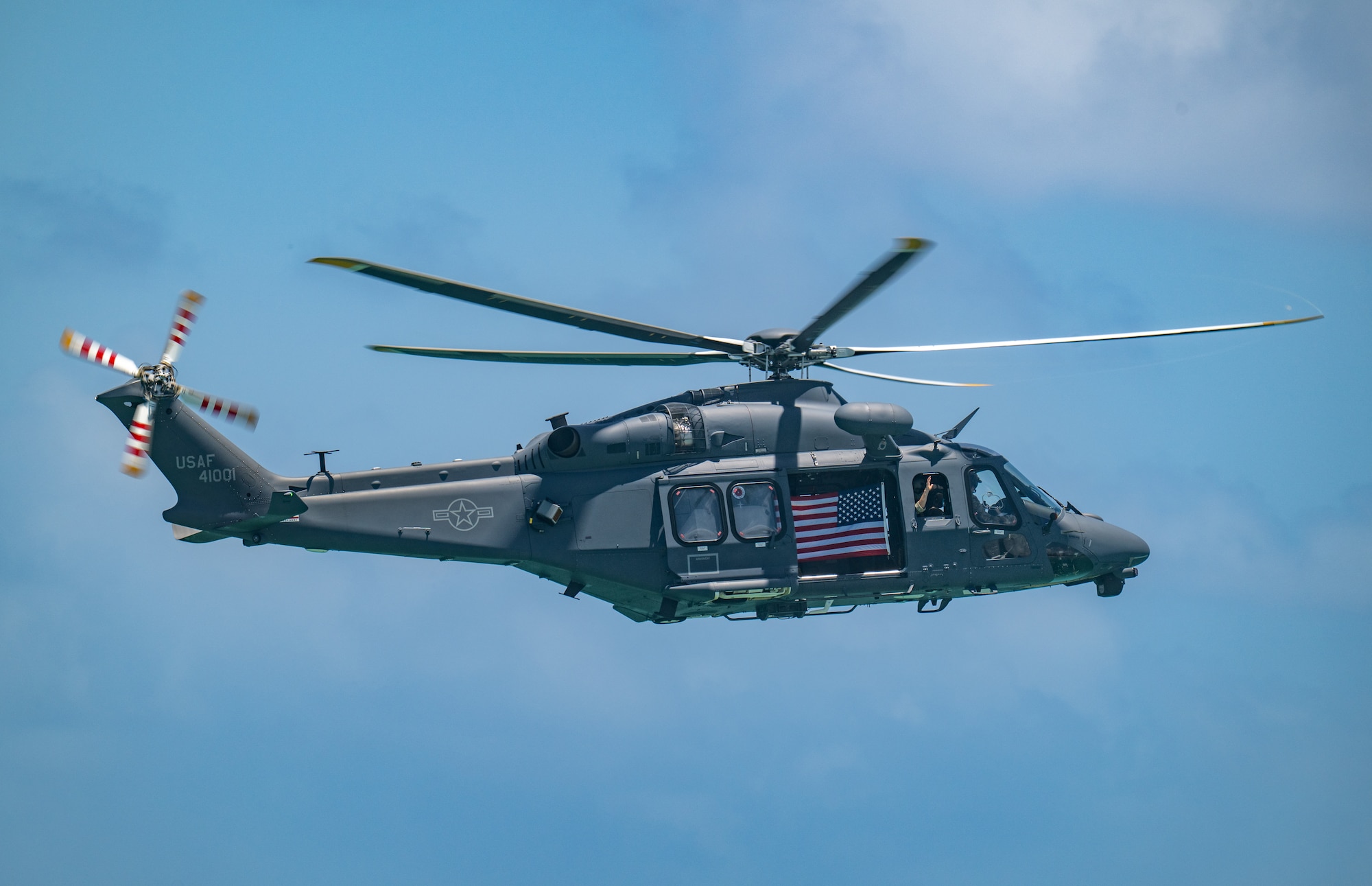 Helicopter flies with U.S. Flag