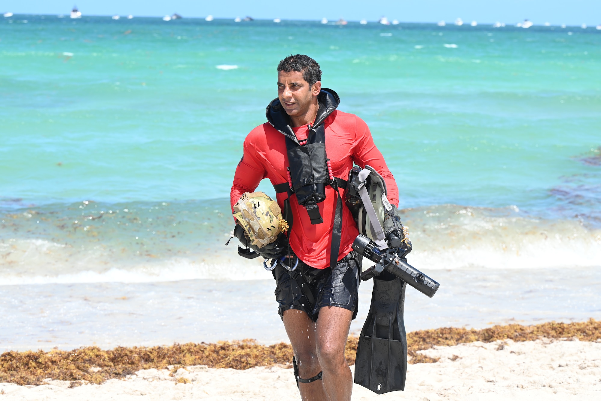 Rescue swimmer walks onto beach