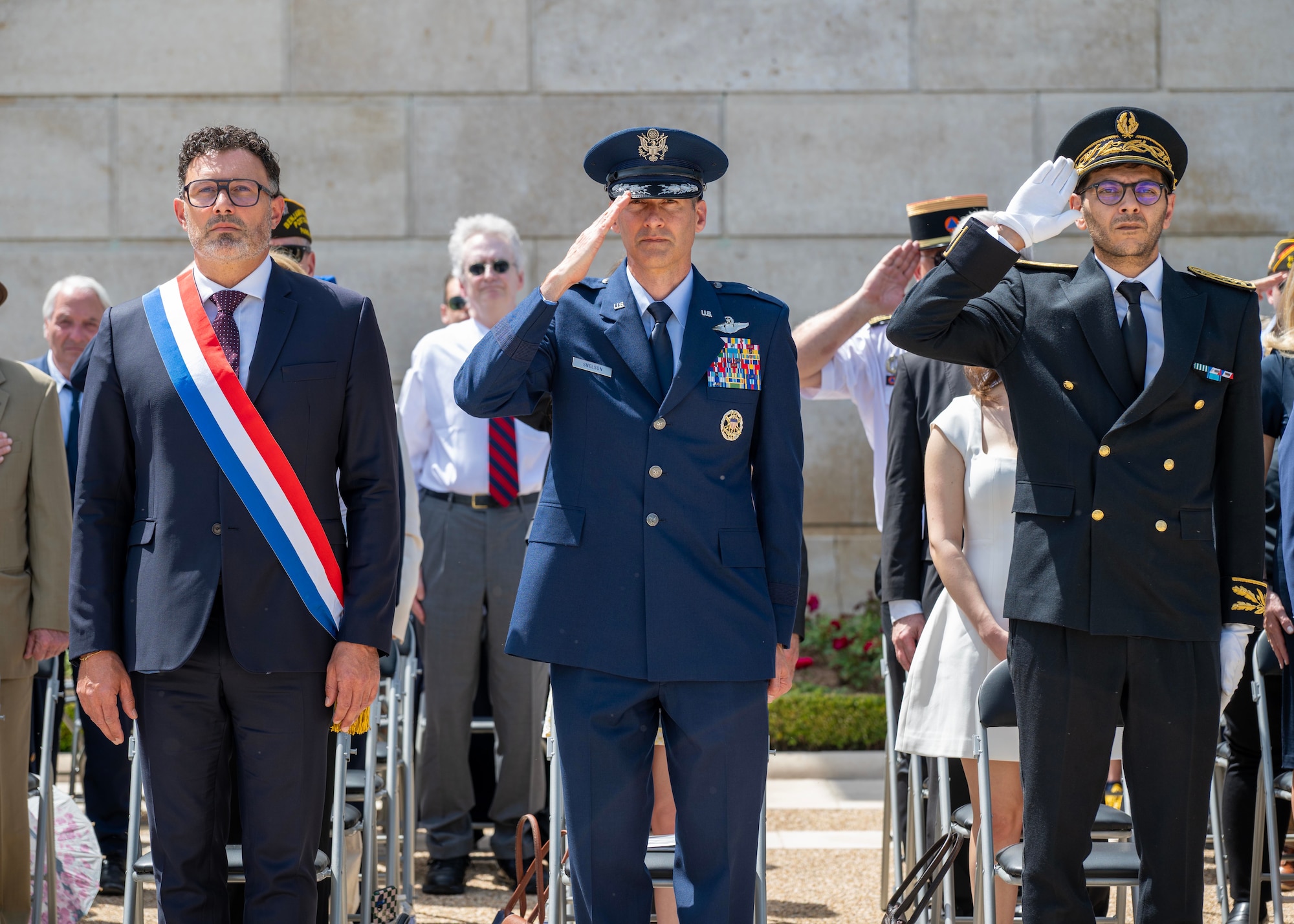 Distinguished guests render a salute during a Memorial Day ceremony held at Suresnes American Cemetery, Suresnes, France, May 24, 2026.