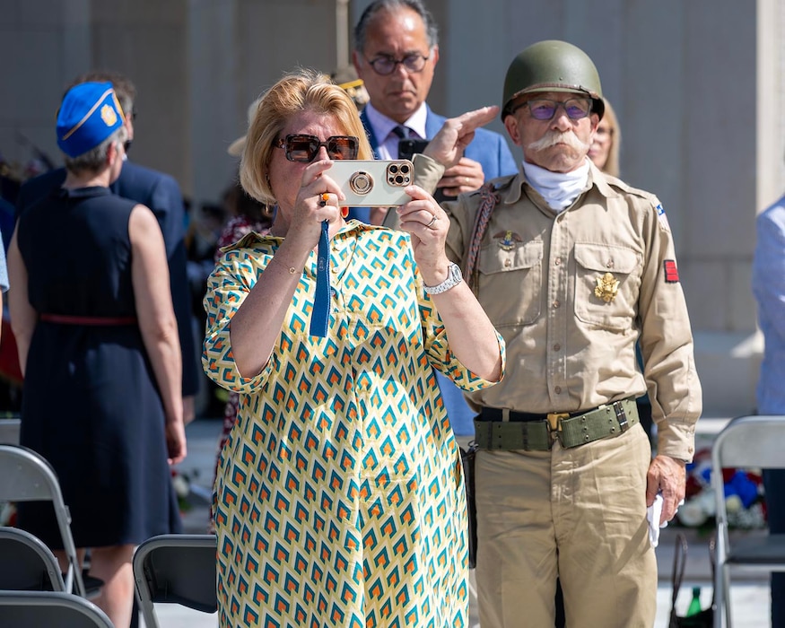 An attendee renders a salute during a Memorial Day ceremony held at the Lafayette Escadrille Memorial, Marnes-la-Coquette, France, May 24, 2026.