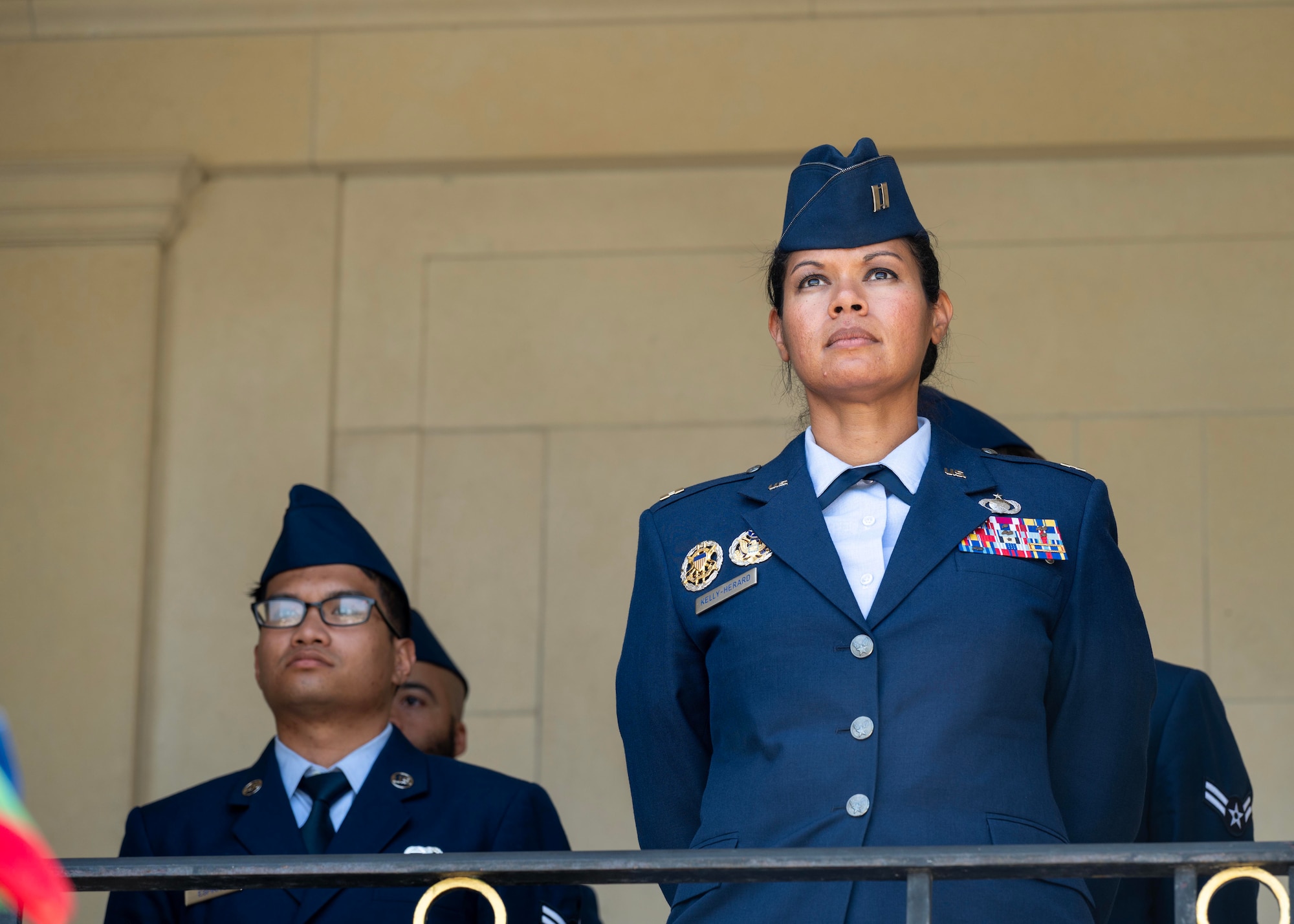 U.S. Air Force Capt. Amber Kelly-Herard, 435th Air Ground Operations Wing public affairs officer, right, and U.S. Air Force Airman 1st Class Arvin Espiritu, 435th Contingency Response Squadron air transportation specialist, stand in formation during a Memorial Day ceremony held at the Suresnes American Cemetery and Memorial, Suresnes, France, May 24, 2026.