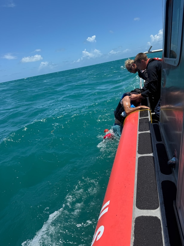 A U.S. Coast Guard Station Key West boat crew rescue two kayakers, after their kayaks overturned in the vicinity of Fort Zachary Taylor, May 24, 2026. Both kayakers were wearing life jackets and brought ashore with no injuries reported. (U.S. Coast Guard photo)