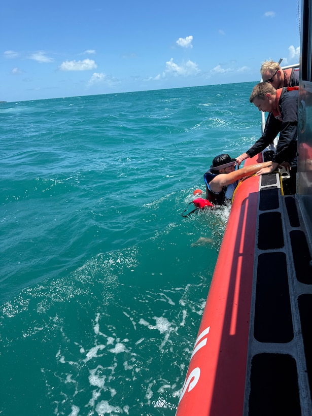 A U.S. Coast Guard Station Key West boat crew rescue two kayakers, after their kayaks overturned in the vicinity of Fort Zachary Taylor, May 24, 2026. Both kayakers were wearing life jackets and brought ashore with no injuries reported. (U.S. Coast Guard photo)