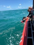 A U.S. Coast Guard Station Key West boat crew rescue two kayakers, after their kayaks overturned in the vicinity of Fort Zachary Taylor, May 24, 2026. Both kayakers were wearing life jackets and brought ashore with no injuries reported. (U.S. Coast Guard photo)