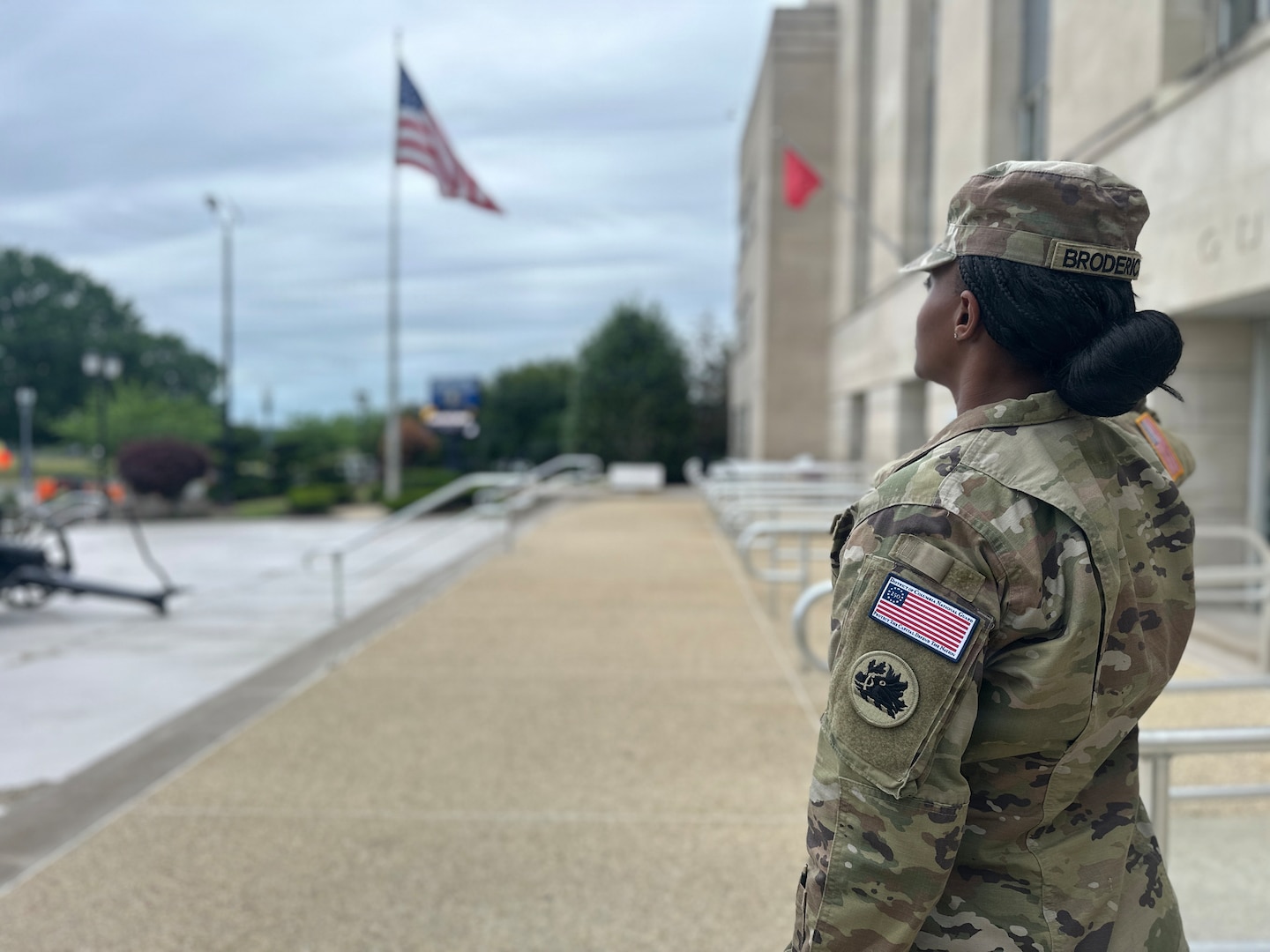 U.S. Army Spc. Shretha Broderick with the Georgia National Guard assigned to Joint Task Force-District of Columbia in support of the DC Safe and Beautiful mission, salutes the American flag while wearing the Freedom 250 Brassard at the DC Armory in Washington, May 21, 2026. About 2,500 National Guard members are supporting the mission, providing critical assistance to the Metropolitan Police Department to help ensure the safety of residents, commuters and visitors throughout the District.