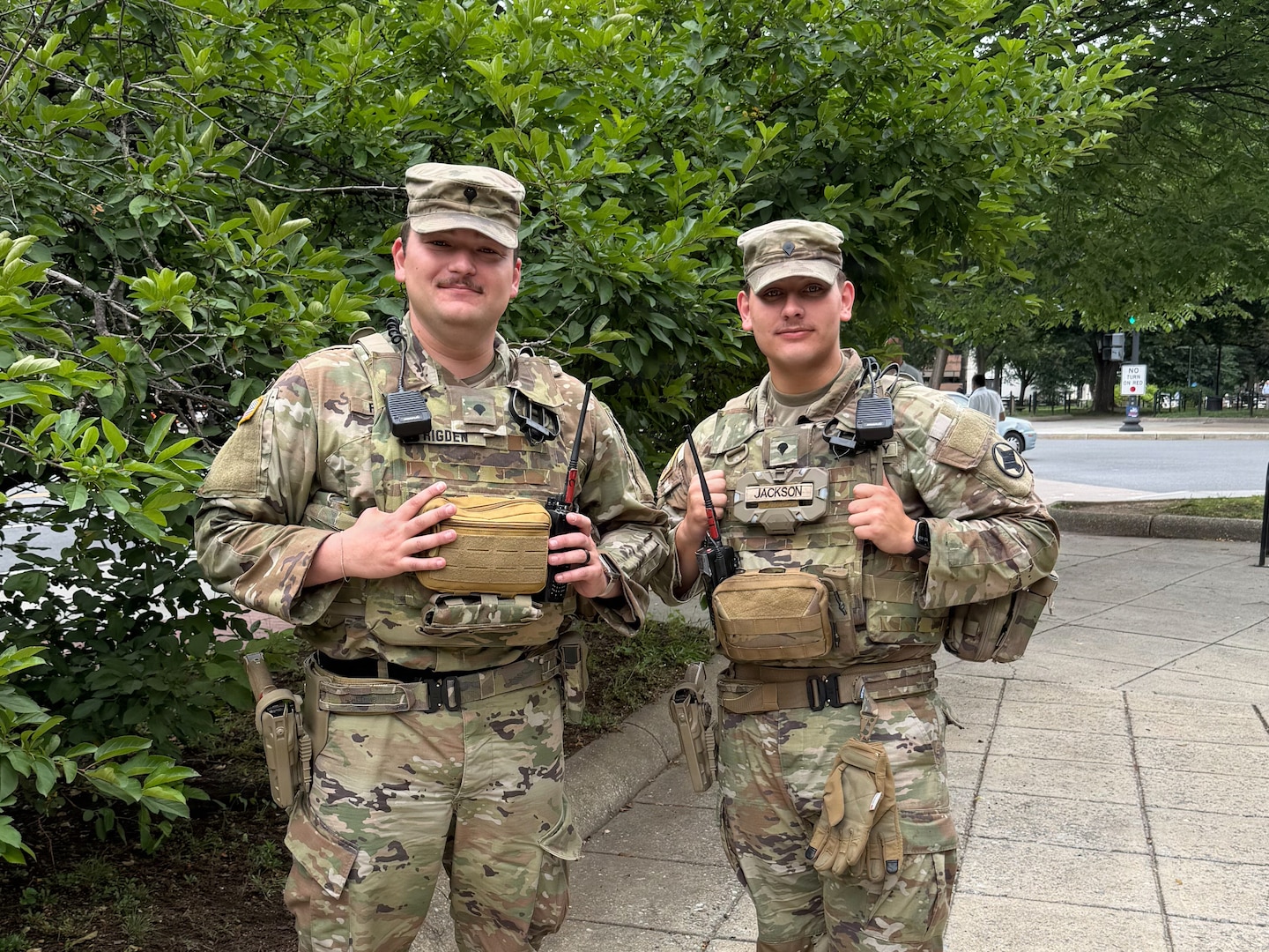 U.S. Army Spc. Brennan Ridgen, a combat medic, left, and Spc. Logan Jackson, right, an artilleryman, both with the Arkansas National Guard currently assigned to Joint Task Force-District of Columbia in support of the DC Safe and Beautiful mission, pose for a portrait near Dupont Circle in Washington, May 21, 2026. About 2,500 National Guard members are supporting the mission, providing critical assistance to the Metropolitan Police Department to help ensure the safety of residents, commuters and visitors throughout the District.