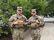 U.S. Army Spc. Brennan Ridgen, a combat medic, left, and Spc. Logan Jackson, right, an artilleryman, both with the Arkansas National Guard currently assigned to Joint Task Force-District of Columbia in support of the DC Safe and Beautiful mission, pose for a portrait near Dupont Circle in Washington, May 21, 2026. About 2,500 National Guard members are supporting the mission, providing critical assistance to the Metropolitan Police Department to help ensure the safety of residents, commuters and visitors throughout the District.