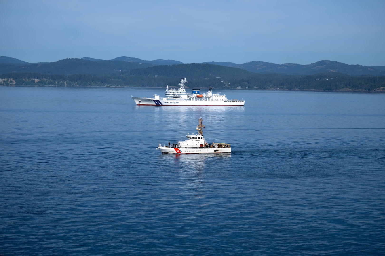 U.S. Coast Guard Cutter Osprey (WPB-87307) and Japan Coast Guard ship Itsukushima transit the Strait of Juan de Fuca during a joint search and rescue exercise, May 21, 2026.