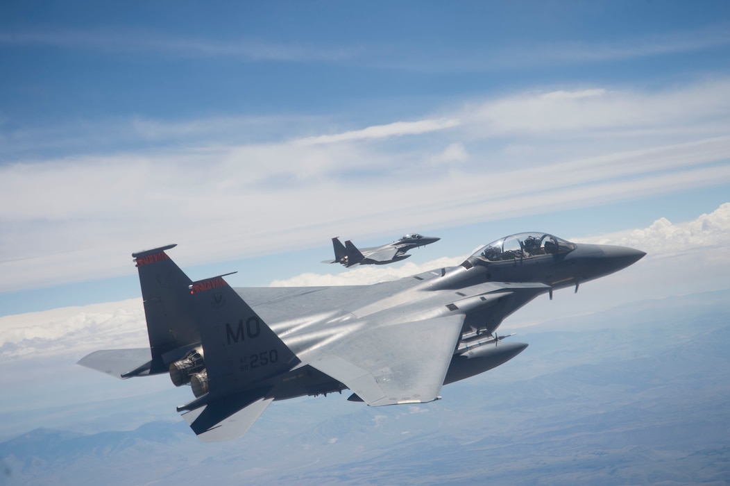 Two U.S. Air Force F-15E Strike Eagles, assigned to the 391st Fighter Squadron from Mountain Home Air Force Base, Idaho, fly over the Utah Test and Training Range July 3, 2018. The F-15E Strike Eagle is a dual-role fighter designed to perform air-to-air and air-to-ground missions.(U.S. Air Force photo by Airman 1st Class Codie Trimble)