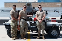 U.S. Air National Guard service members assigned to the 21st Fighter Squadron Aircraft Maintenance Unit gather during the annual Weapons Load Competition at Morris Air National Guard Base, Arizona, May 1, 2026.