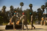 U.S. Air Force Senior Master Sgt. Reuben Dominguez, 163rd Regional Training Site superintendent, California Air National Guard, gives kudos to Airmen after operating a skid-steer successfully during a weeklong Rapid Damage Repair course at March Air Reserve Base, California, May 19, 2026.