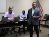 AMLC M3D director talks to medical maintenance operations division leaders during management review session at Hill Air Force Base, Utah.