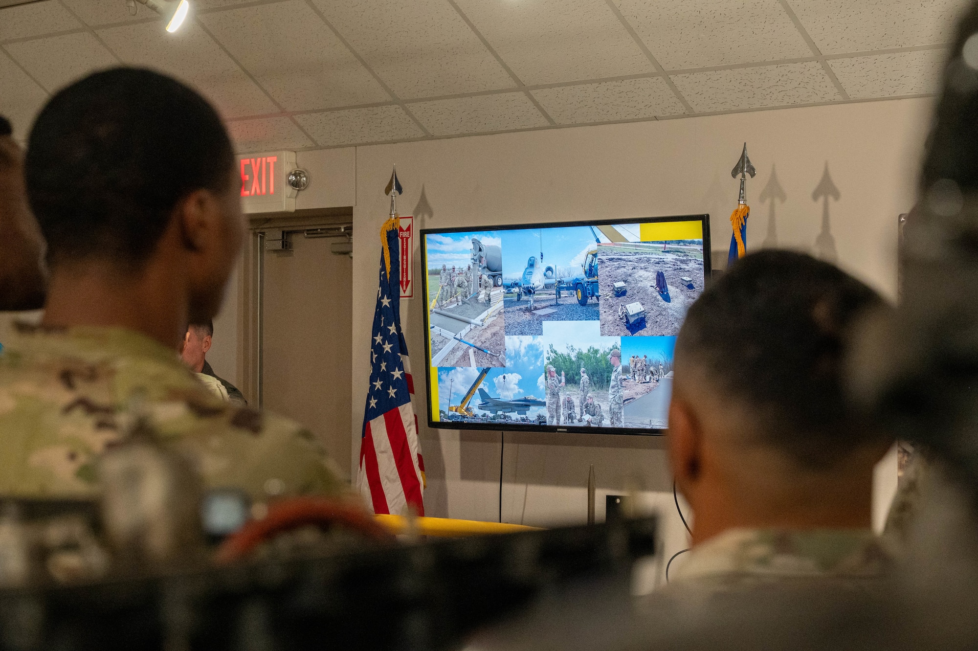 Photos of the newly dedicated A-10 Thunderbolt II and F-16 Fighting Falcon static displays are shown on a television during a yellow ribbon-cutting ceremony inside the Dyess Memorial Museum at Dyess Air Force Base, Texas, May 21, 2026. The photos highlighted the result of a three-year construction project by the 7th Civil Engineer Squadron, which involved pouring over 70 cubic yards of concrete and precisely craning the aircraft into their permanent positions at the Linear Air Park. (U.S. Air Force photo by Airman 1st Class William Neal)