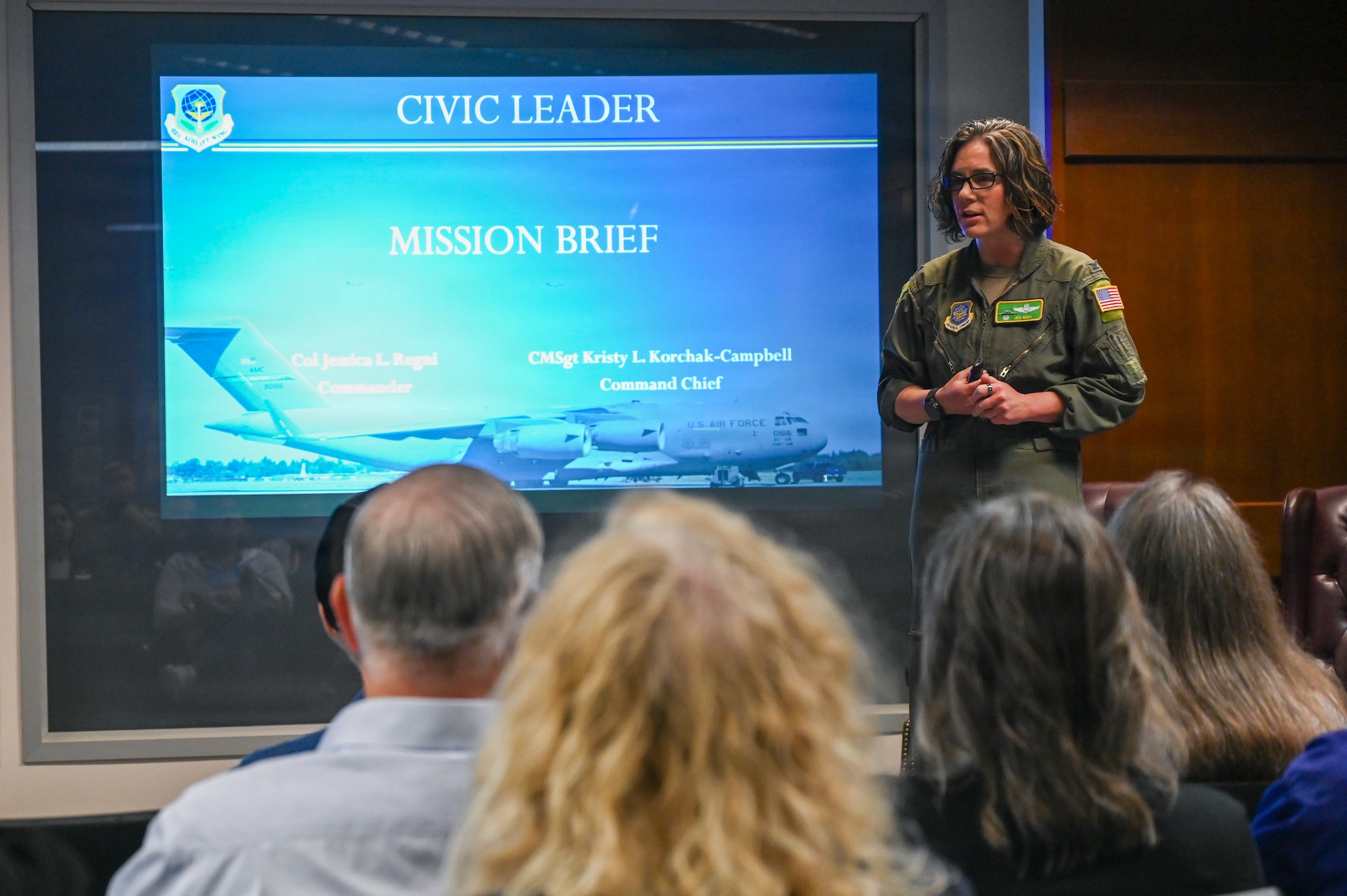 U.S. Air Force Col. Jessica Regni, 62d Airlift Wing commander, briefs local civic leaders at Joint Base Lewis-McChord, Washington, May 19, 2026.