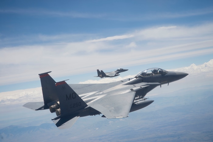 Two U.S. Air Force F-15E Strike Eagles, assigned to the 391st Fighter Squadron from Mountain Home Air Force Base, Idaho, fly over the Utah Test and Training Range July 3, 2018. The F-15E Strike Eagle is a dual-role fighter designed to perform air-to-air and air-to-ground missions.(U.S. Air Force photo by Airman 1st Class Codie Trimble)