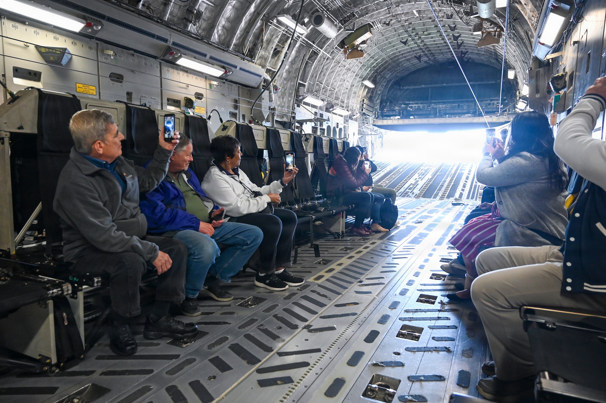 Local civic leaders capture a 62d Airlift Wing C-17 Globemaster III cargo door opening mid-flight above central Washington, May 19, 2026.