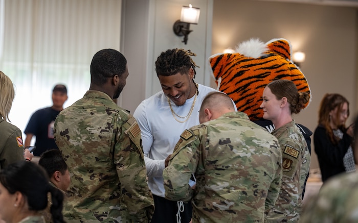 Cincinnati Bengals Rookie Cashius Howell signs autographs for Airmen of the 88th Air Base Wing May 15, 2026 at Wright-Patterson Air Force Base, Ohio. 19 Bengals rookies made the trip to WPAFB for an interaction with Airmen and to learn about what they do (U.S. Air Force photo by Jack Gardner)
