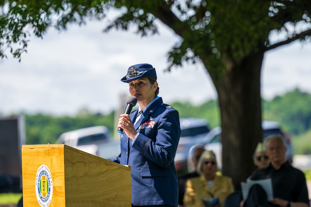 Col. Dorinda Mazza speaks at a podium during a Memorial Day ceremony at the Dayton Vietnam Veterans Memorial in Dayton, Ohio.