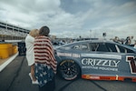 Jane Horton, right, checks out Ty Dillon's No. 10 Chevrolet before the Coca-Cola 600 NASCAR race at Charlotte Motor Speedway in North Carolina, May 24, 2026. Dillon's car carried the name of Horton's husband, Army Spc. Christopher David Horton, a sniper assigned to the Oklahoma Army National Guard's 45th Infantry Brigade Combat Team, who was killed Sept. 9, 2011, in Afghanistan. Courtesy photo.