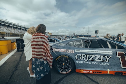 Jane Horton, right, checks out Ty Dillon's No. 10 Chevrolet before the Coca-Cola 600 NASCAR race at Charlotte Motor Speedway in North Carolina, May 24, 2026.