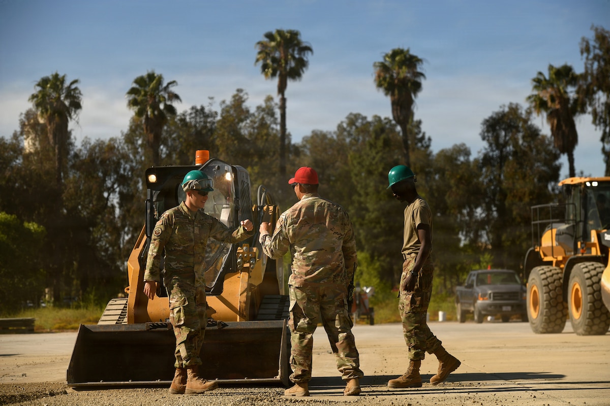 U.S. Air Force Senior Master Sgt. Reuben Dominguez, 163rd Regional Training Site superintendent, California Air National Guard, gives kudos to Airmen after operating a skid-steer successfully during a weeklong Rapid Damage Repair course at March Air Reserve Base, California, May 19, 2026.