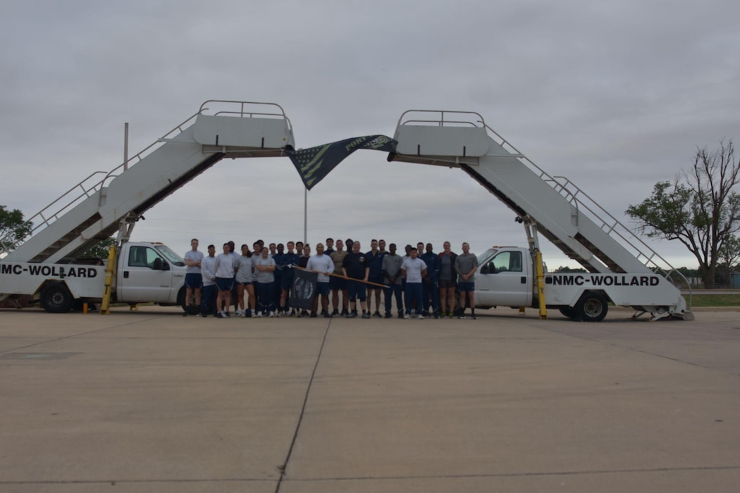 Members assigned to the 97th Logistics Readiness Squadron, “Port Dawgs”, pose for a group photo during the Port Dawg Memorial Run at Altus Air Force Base, Oklahoma, May 8, 2026. The Port Dawg Memorial Run is a solemn opportunity for the Air Transportation community to honor the lives and legacies of fellow “Port Dawgs” who passed away during the previous year. (Courtesy photo)