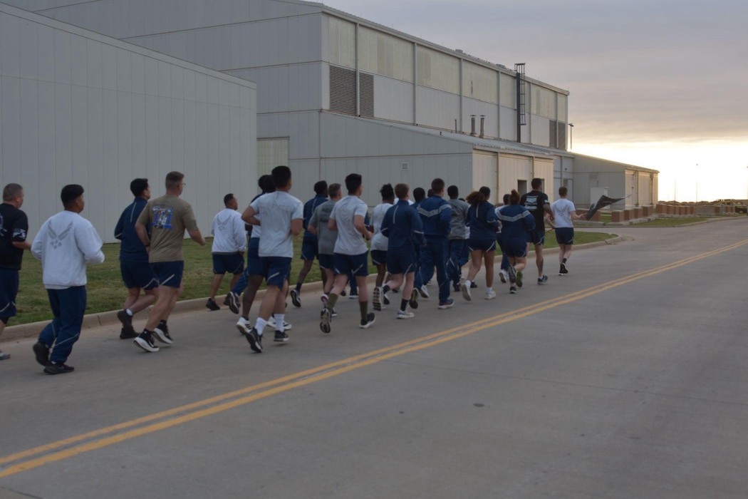 Members assigned to the 97th Logistics Readiness Squadron participate in the Port Dawg Memorial Run at Altus Air Force Base, Oklahoma, May 8, 2026. The Port Dawg Memorial Run is a solemn opportunity for the Air Transportation community to honor the lives and legacies of fellow “Port Dawgs” who passed away during the previous year. (Courtesy photo)