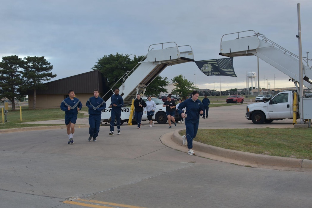 Members assigned to the 97th Logistics Readiness Squadron take part in the Port Dawg Memorial Run at Altus Air Force Base, Oklahoma, May 8, 2026. The Port Dawg Memorial Run is a solemn opportunity for the Air Transportation community to honor the lives and legacies of fellow “Port Dawgs” who passed away during the previous year. (Courtesy photo)