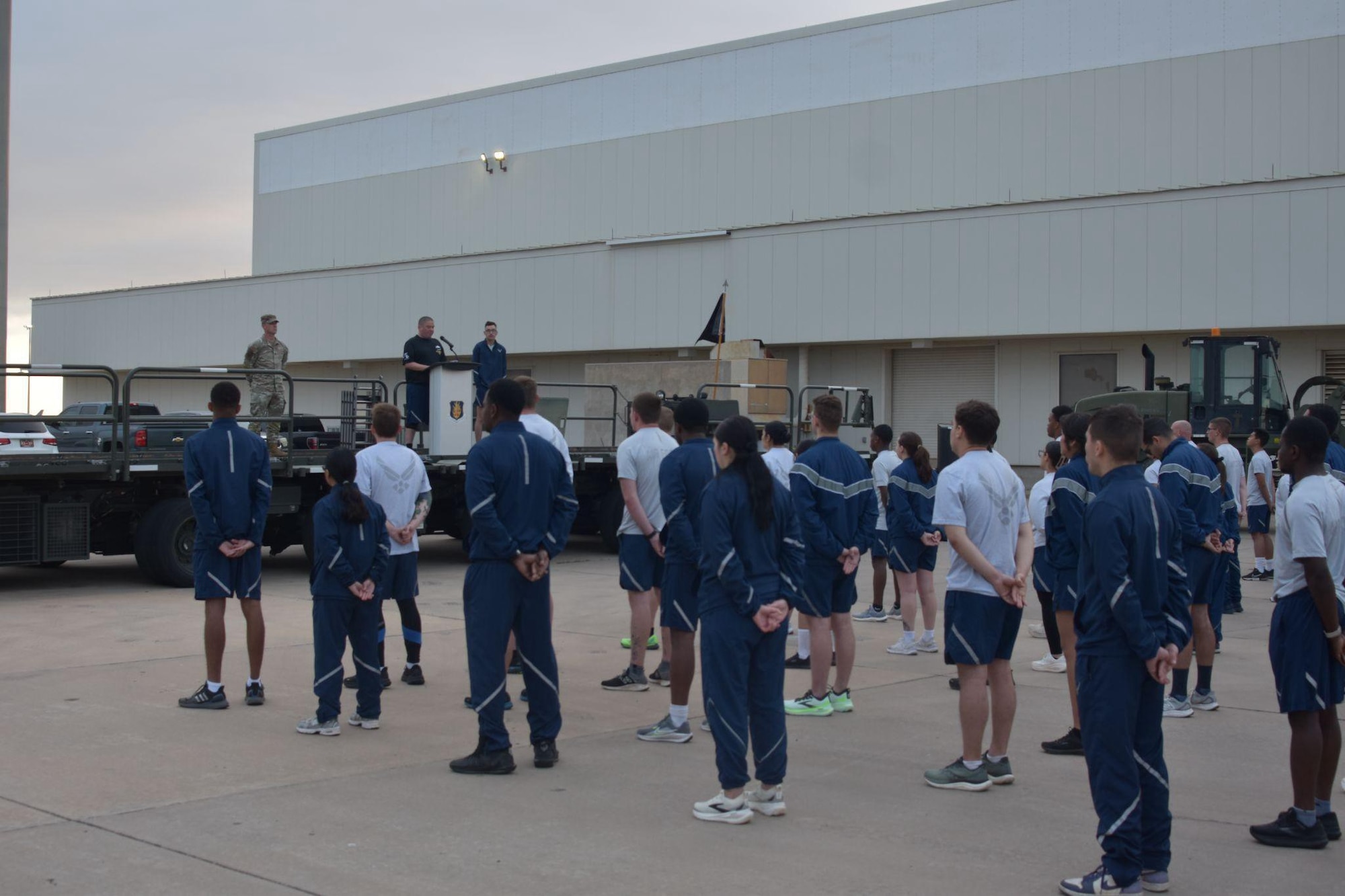 Members assigned to the 97th Logistics Readiness Squadron stand in formation during the Port Dawg Memorial Run at Altus Air Force Base, Oklahoma, May 8, 2026. The Port Dawg Memorial Run is a solemn opportunity for the Air Transportation community to honor the lives and legacies of fellow “Port Dawgs” who passed away during the previous year. (Courtesy photo)