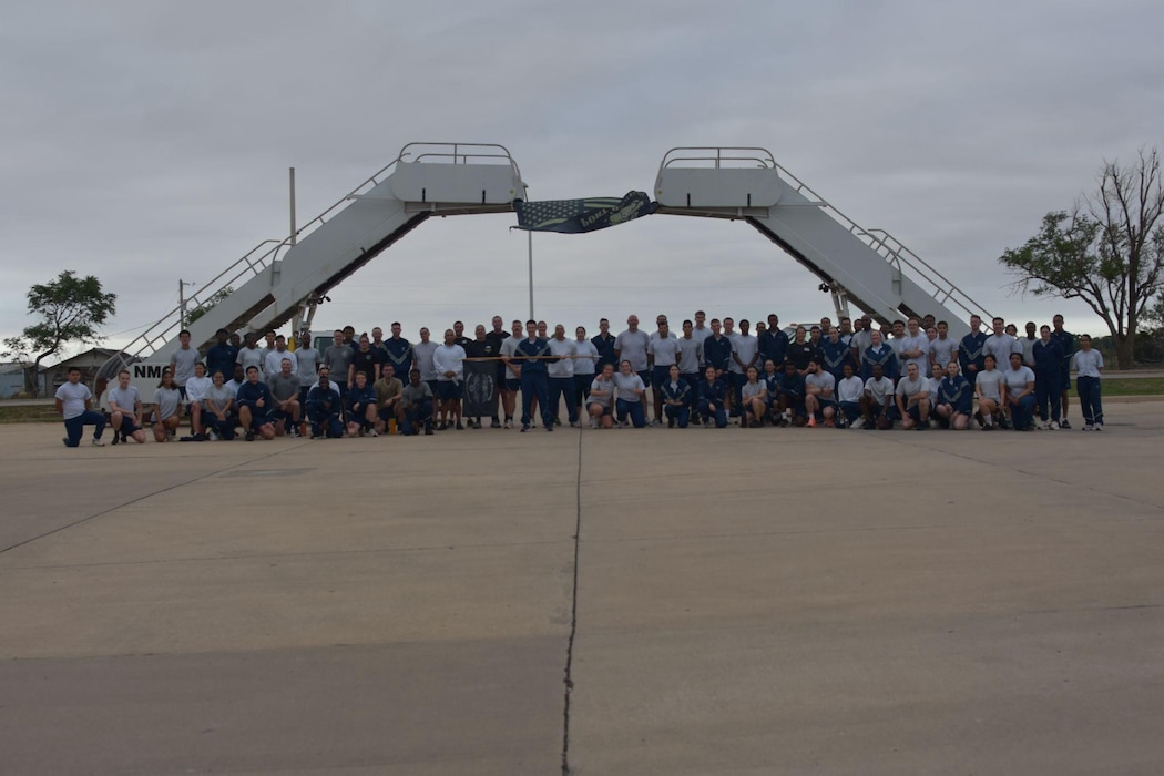 Members assigned to the 97th Logistics Readiness Squadron pose for a group photo during the Port Dawg Memorial Run at Altus Air Force Base, Oklahoma, May 8, 2026. The Port Dawg Memorial Run is a solemn opportunity for the Air Transportation community to honor the lives and legacies of fellow “Port Dawgs” who passed away during the previous year. (Courtesy photo)