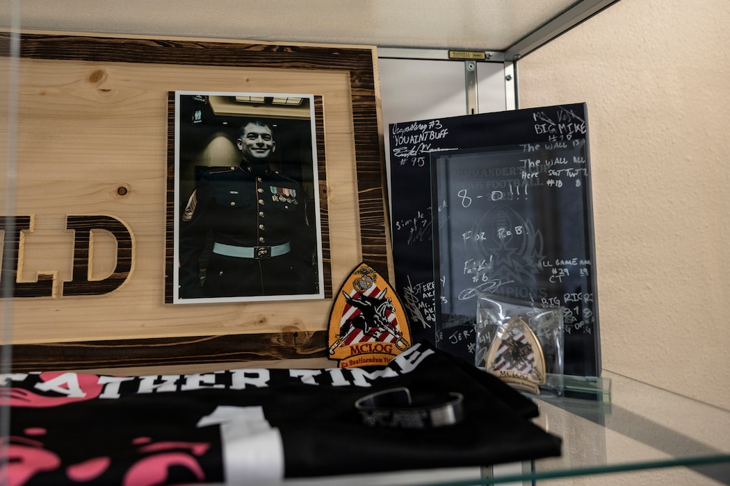 The photo of Gunnery Sgt. Robert McDonald, who tragically passed away on May 20, 2024, is displayed by the Marine Corps Logistics and Operations Group's flag football team, known as the Rusty Buffaloes, Marine Corps Air Ground Combat Center, California, March 30, 2026. 