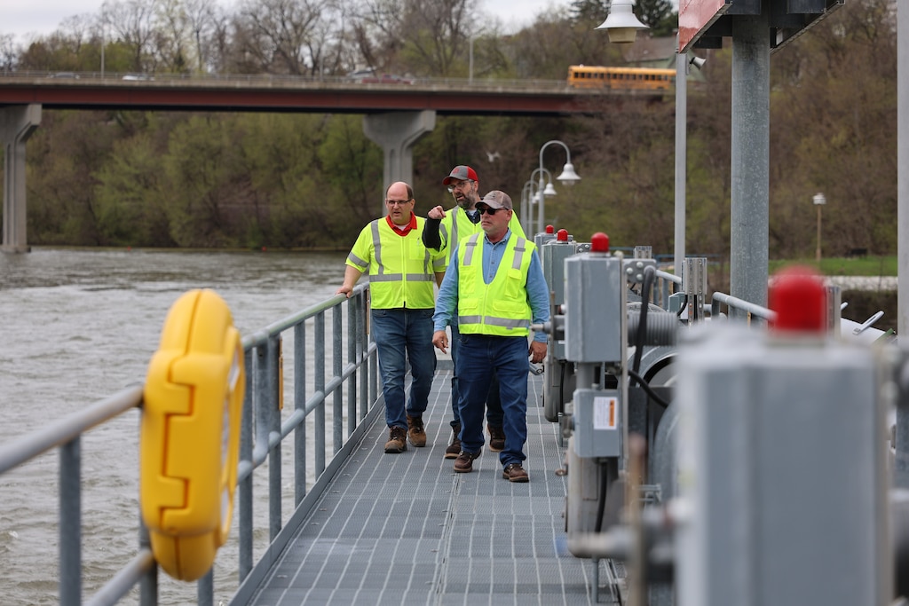 Chief of Emergency Management Bob Paluch, Acting Chief of the Operations and Regulatory Division, David Buccaro and Fox River Section Chief and Engineering Technician, Ray Frana take a look at dam operations and notate any damage or concerns during an inspection during the April flooding event in Wisconsin