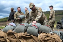 Army parachute riggers assigned to Defense Logistics Agency Distribution, Susquehanna, Pennsylvania, join airmen from the 148th Air Support Operations Squadron, a subordinate unit of the 193rd Special Operations Wing based at Fort Indiantown Gap, for a static line jump at Fort Indiantown Gap, April 30, 2026. (DOW photo by Dorie Heyer, released)