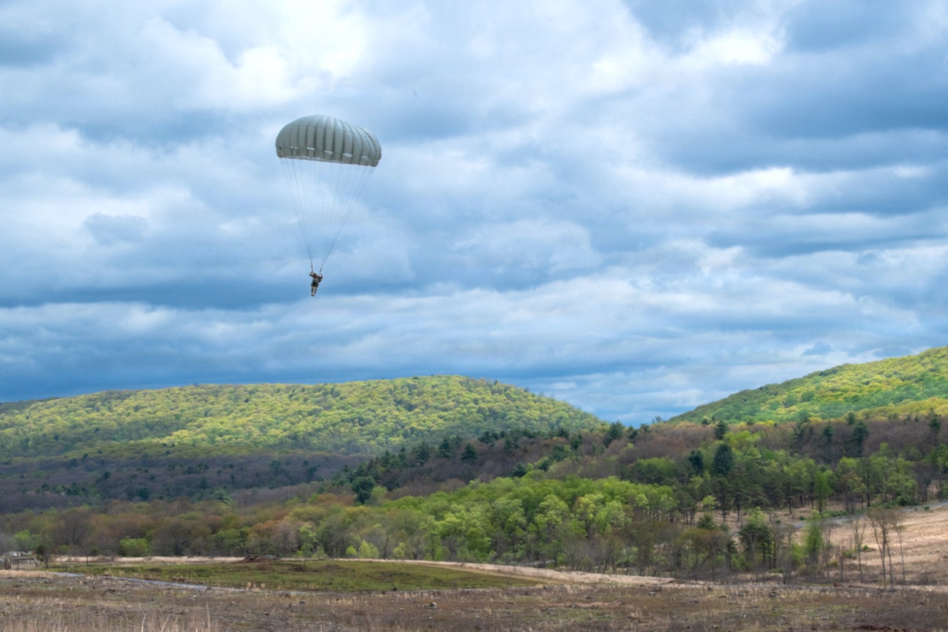 Army parachute riggers assigned to Defense Logistics Agency Distribution, Susquehanna, Pennsylvania, join airmen from the 148th Air Support Operations Squadron, a subordinate unit of the 193rd Special Operations Wing based at Fort Indiantown Gap, for a static line jump at Fort Indiantown Gap, April 30, 2026. (DOW photo by Dorie Heyer, released)