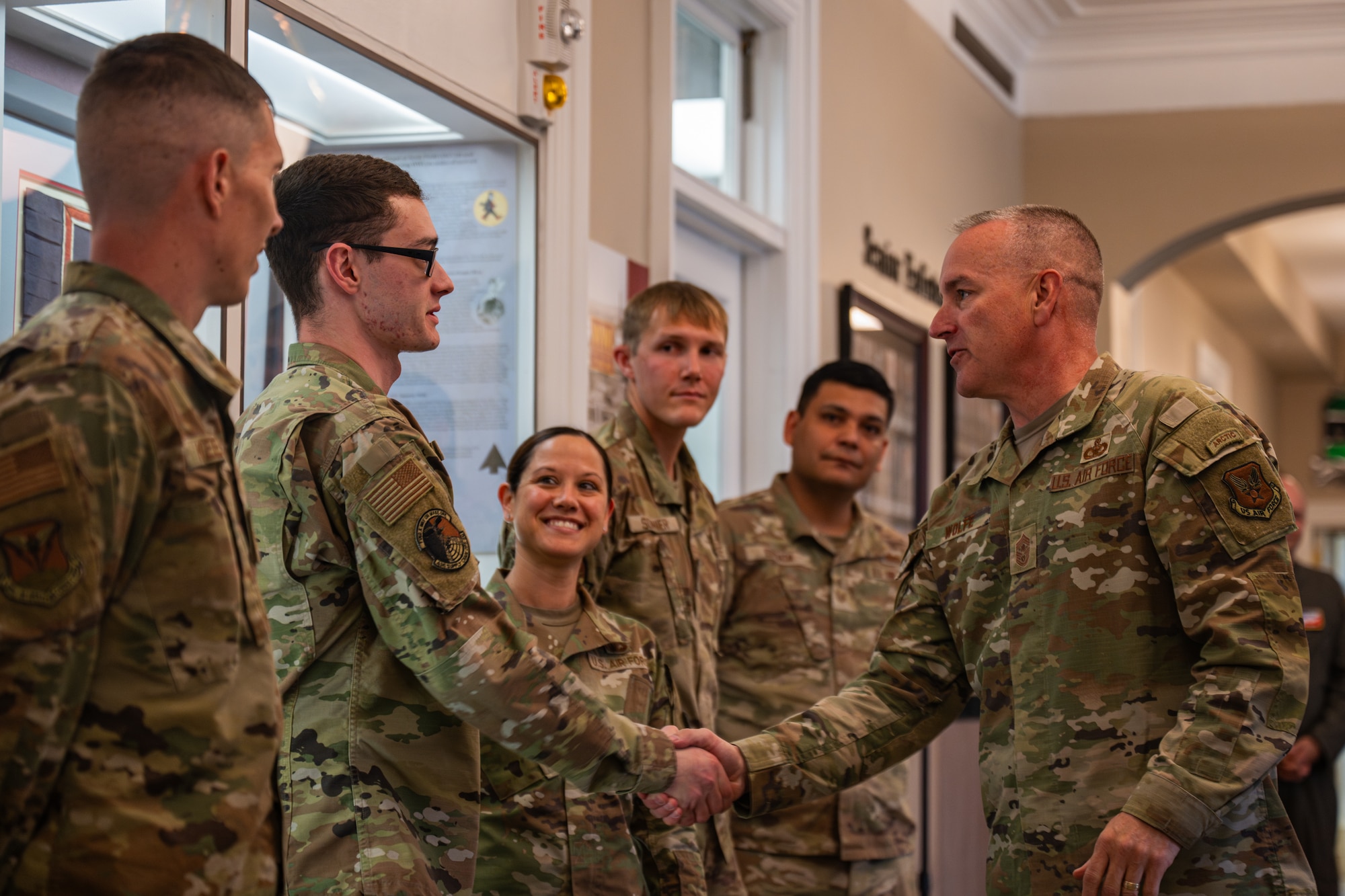 CMSAF gives coin to Airman