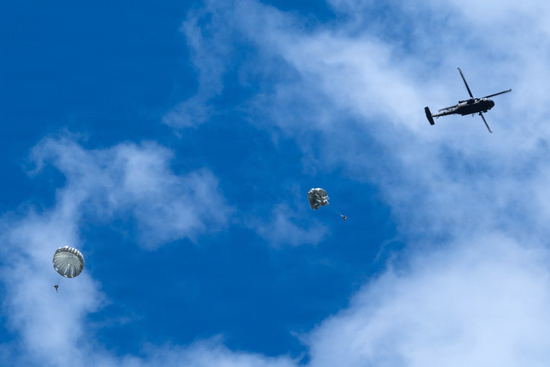 Army parachute riggers assigned to Defense Logistics Agency Distribution, Susquehanna, Pennsylvania, join airmen from the 148th Air Support Operations Squadron, a subordinate unit of the 193rd Special Operations Wing based at Fort Indiantown Gap, for a static line jump at Fort Indiantown Gap, April 30, 2026. (DOW photo by Dorie Heyer, released)