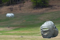 Army parachute riggers assigned to Defense Logistics Agency Distribution, Susquehanna, Pennsylvania, join airmen from the 148th Air Support Operations Squadron, a subordinate unit of the 193rd Special Operations Wing based at Fort Indiantown Gap, for a static line jump at Fort Indiantown Gap, April 30, 2026. (DOW photo by Dorie Heyer, released)