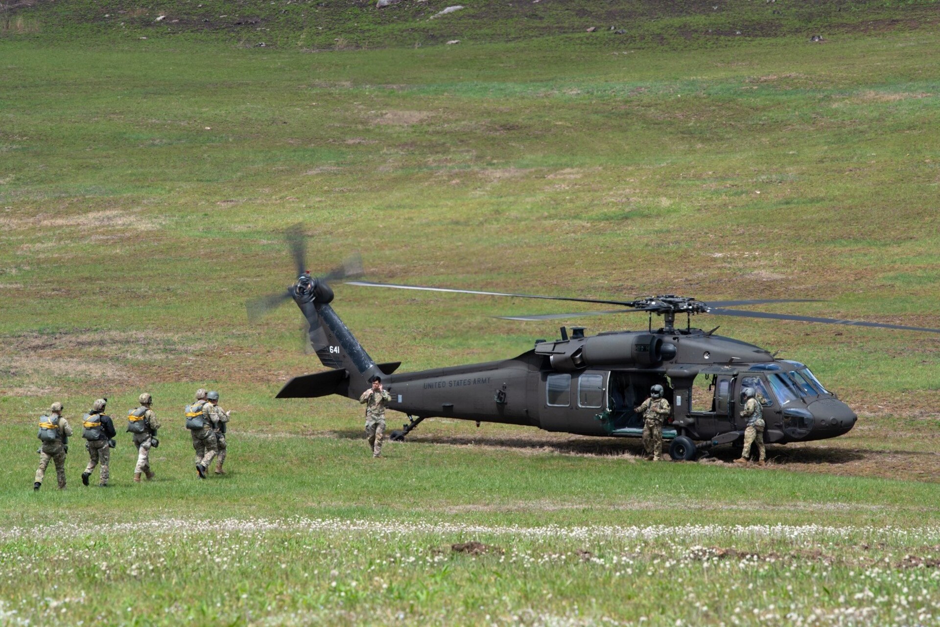 Army parachute riggers assigned to Defense Logistics Agency Distribution, Susquehanna, Pennsylvania, join airmen from the 148th Air Support Operations Squadron, a subordinate unit of the 193rd Special Operations Wing based at Fort Indiantown Gap, for a static line jump at Fort Indiantown Gap, April 30, 2026. (DOW photo by Dorie Heyer, released)