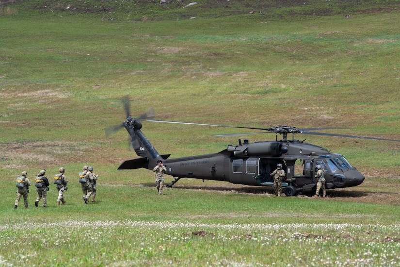 Army parachute riggers assigned to Defense Logistics Agency Distribution, Susquehanna, Pennsylvania, join airmen from the 148th Air Support Operations Squadron, a subordinate unit of the 193rd Special Operations Wing based at Fort Indiantown Gap, for a static line jump at Fort Indiantown Gap, April 30, 2026. (DOW photo by Dorie Heyer, released)