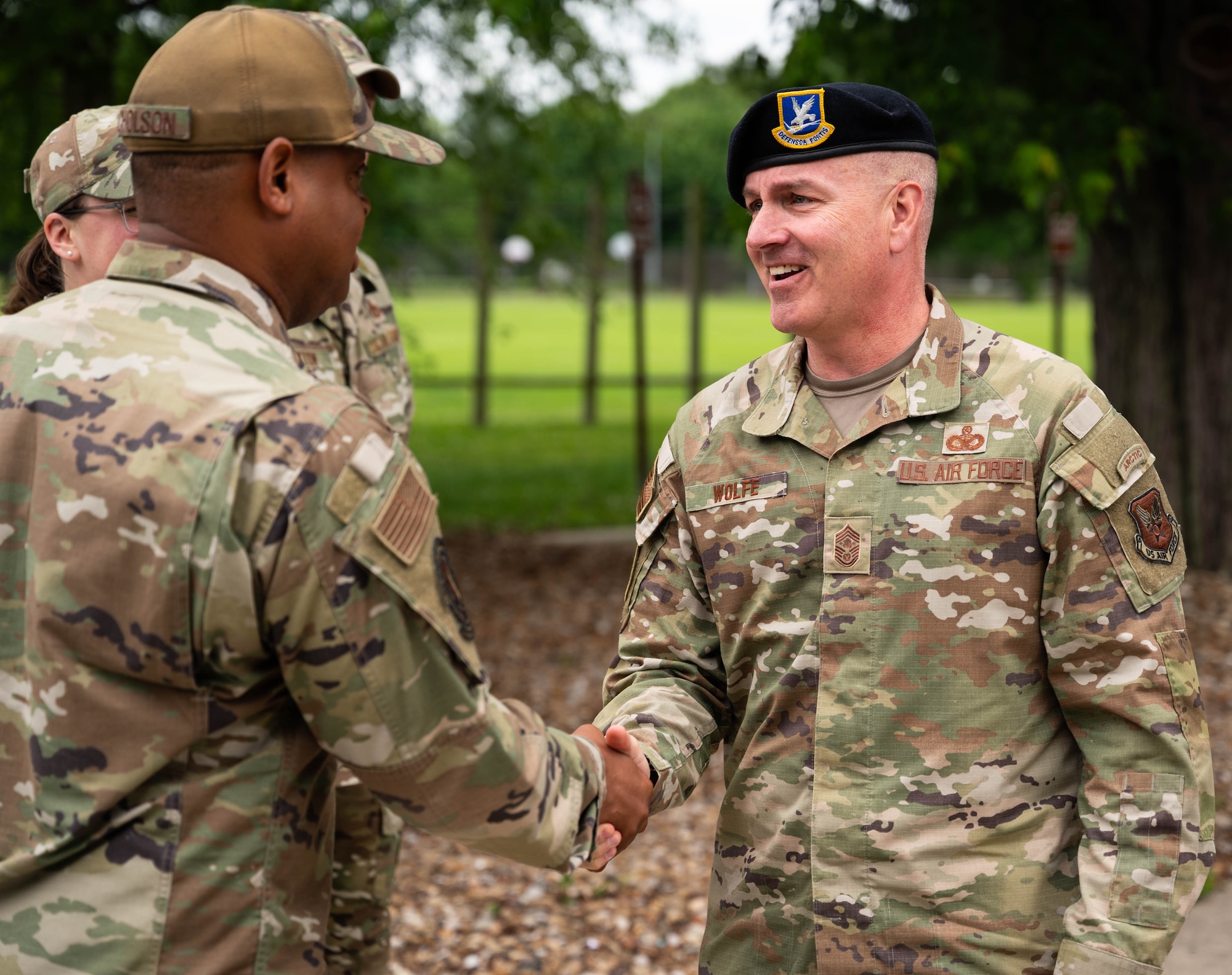 CMSAF shakes Airman's hand