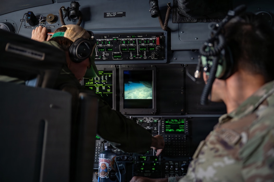 People using a control panel.