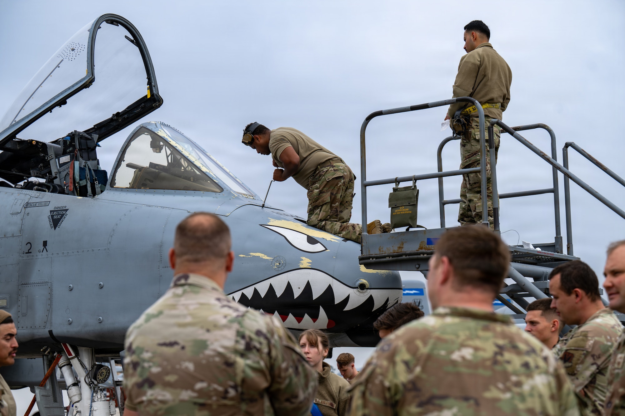 Maintainers working on an A-10C Thunderbolt II.